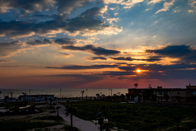 Scenic view of beach against sky during sunset