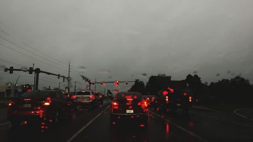 Traffic on road at dusk