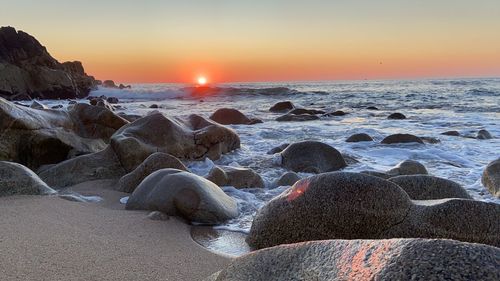 Scenic view of sea against sky during sunset