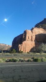 Rock formations in desert against blue sky