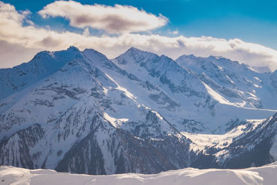 Scenic view of snowcapped mountains against sky