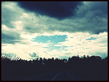 Silhouette trees against sky