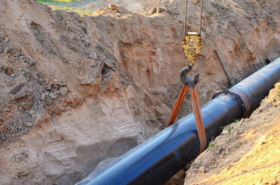 High angle view of pipe on rock