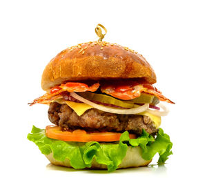 Close-up of burger against white background