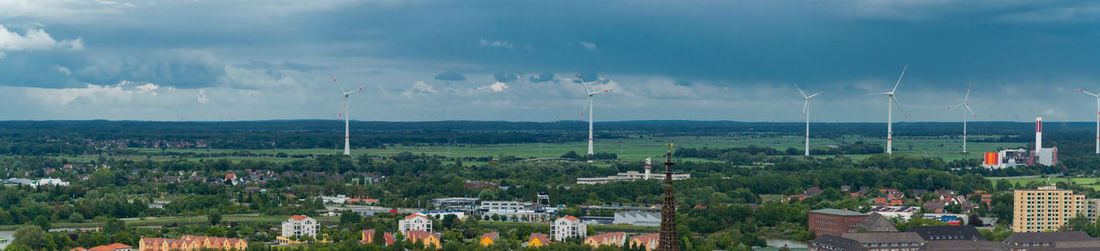 Panoramic view of buildings in city against sky