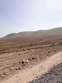 Scenic view of desert against clear sky