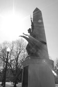 Low angle view of statue against sky