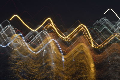 Light trails against sky at night