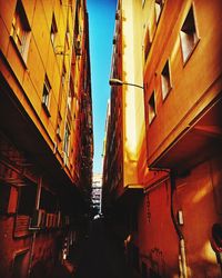 Low angle view of buildings against sky during sunset