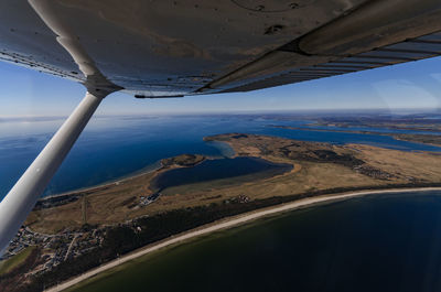 Aerial view of landscape and sea against sky