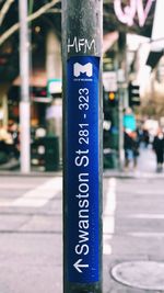 Close-up of information sign on street