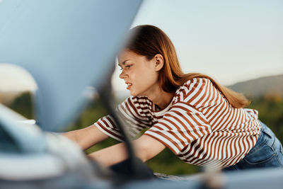 Side view of young woman looking away