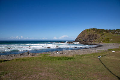 Scenic view of sea against clear blue sky