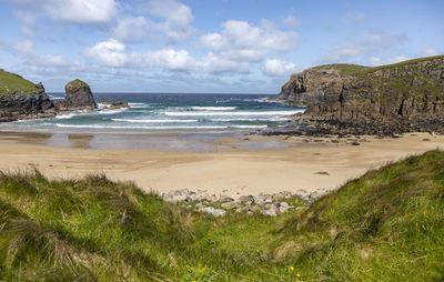 Scenic view of beach against sky