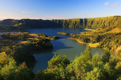 Scenic view of lake amidst landscape during sunset at azores