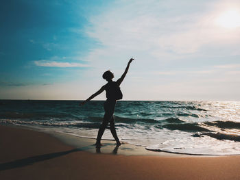 Woman ballet dancing at beach