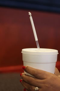 Close-up of hand holding drink