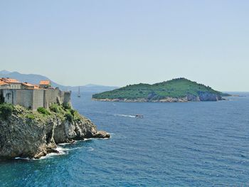 Scenic view of sea against blue sky