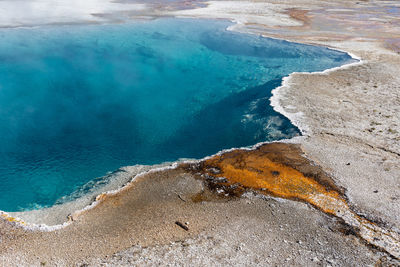 Brilliant blue thermal pool in west thumb basin in yellowstone national park