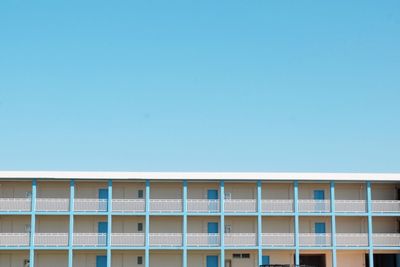 Low angle view of building against clear blue sky