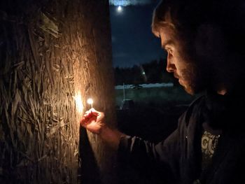 Portrait of man looking at night