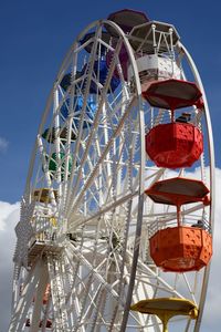 Low angle view of ferris wheel against sky