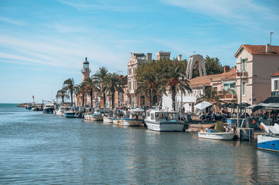 Boats in sea against sky