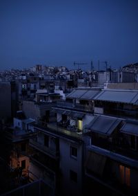 High angle view of illuminated buildings against clear sky