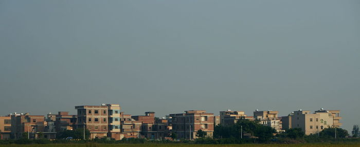 Buildings against clear sky