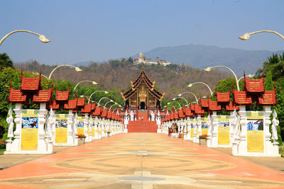 Row of empty chairs against clear sky