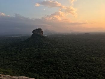 Scenic view of landscape against sky during sunset