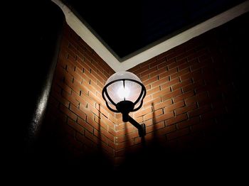 Low angle view of illuminated light bulb