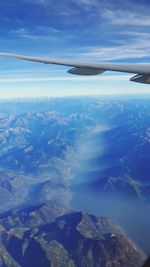 Aerial view of sea and landscape against sky