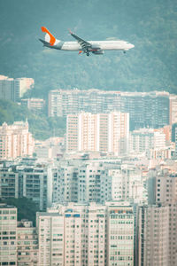 Aerial view of city against sky