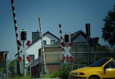 Road sign against clear sky