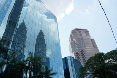 Low angle view of modern buildings against sky