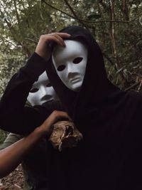 Men wearing spooky mask