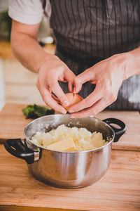 Close-up of man preparing food