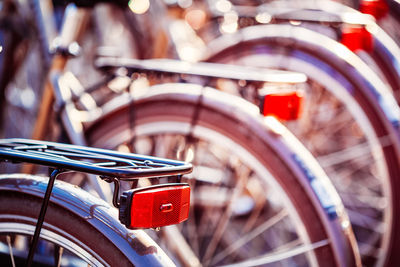 Close-up of bicycles parked outdoors