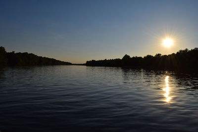 Scenic view of sunset over river