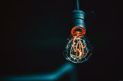 Close-up of illuminated light bulb