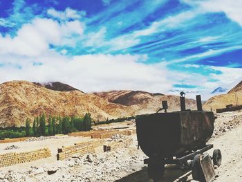 Panoramic view of land and mountains against sky