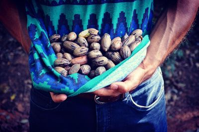 Midsection of man holding food