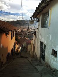 Houses in town against sky