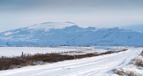 Scenic view of snowcapped mountains against sky