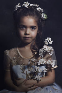 Portrait of a girl with red flower