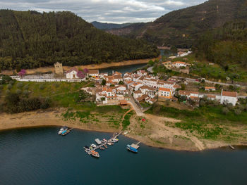 High angle view of townscape by mountain