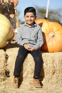 Full length portrait of a smiling boy