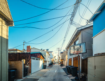 Street amidst buildings against sky