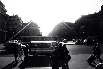 People walking on road in city